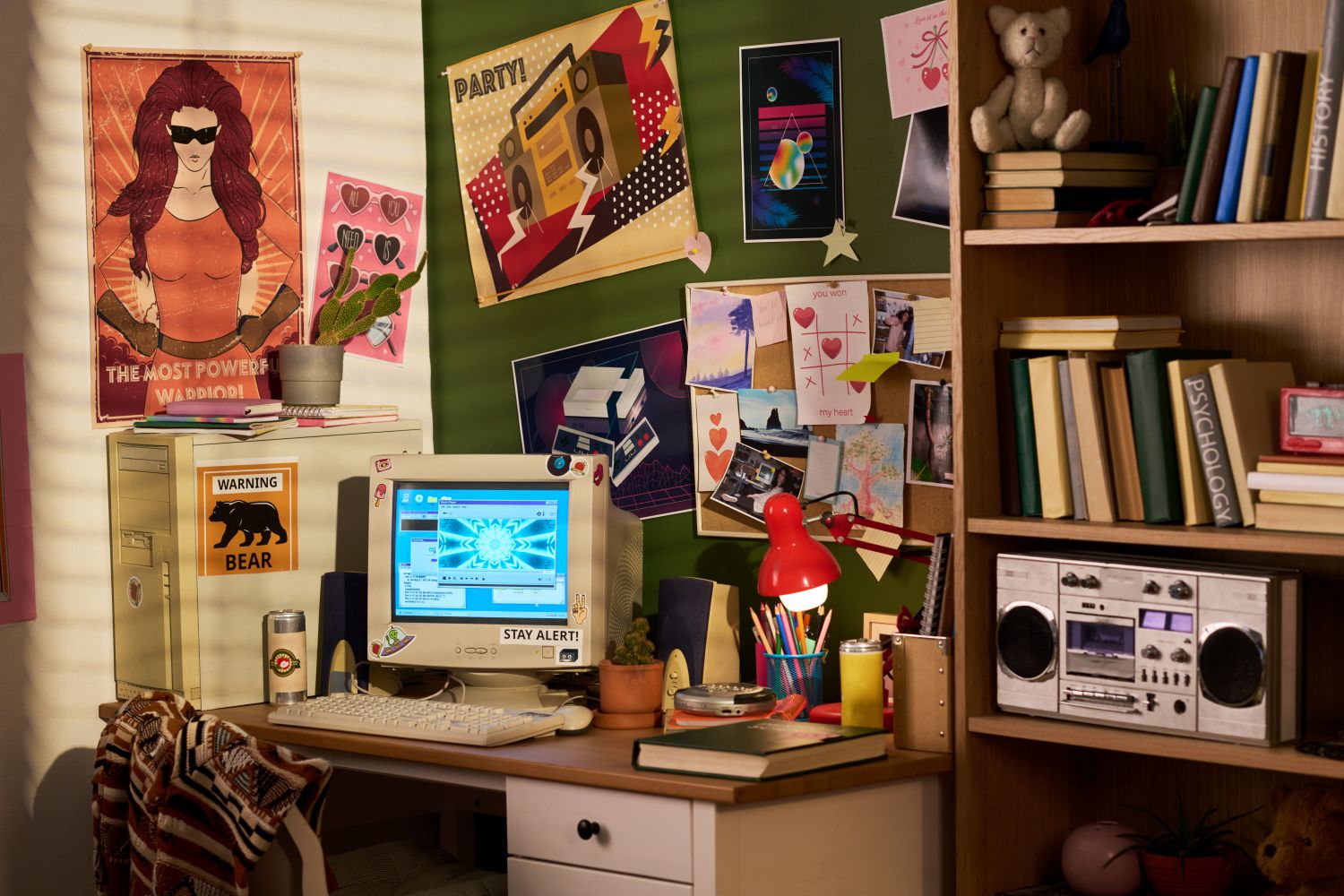 The computer desk has pictures of idols.